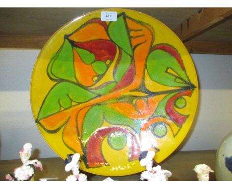 Large Poole Pottery charger decorated with an abstract design