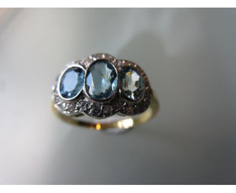 18ct Yellow gold triple aquamarine and diamond cluster ring