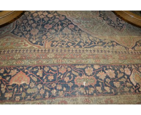 Tabriz carpet with medallion and all-over stylised floral design on an ivory ground with borders (extensive wear)