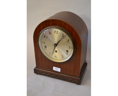 Early 20th Century mahogany and dome shaped mantel clock with a three train striking movement