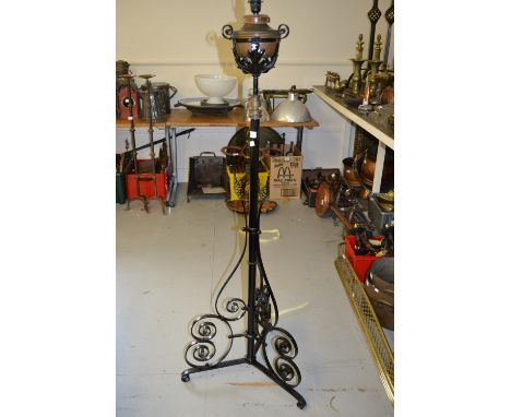 Black painted wrought iron, brass and copper oil lamp standard adapted for use with electricity