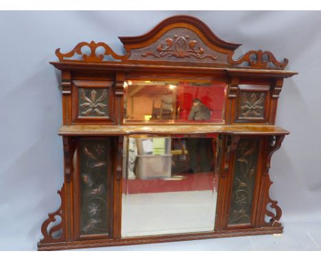 An Art Nouveau mahogany over mantle mirror inset with embossed copper plaques, H 112 x W 106cm 