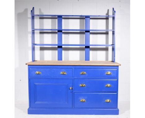 Blue painted pine kitchen dresser, with a scrubbed top, open shelf back with bank of three drawers flanked by further drawer 