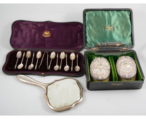 A pair of silver back brushes hallmarked Birmingham 1904, in a velvet lined case by retailer Sampson Marks & Co. Johannesburg