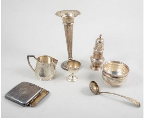 Silver baluster shape caster, silver milk jug, sugar bowl, egg cup, and a Scottish silver ladle. (5)