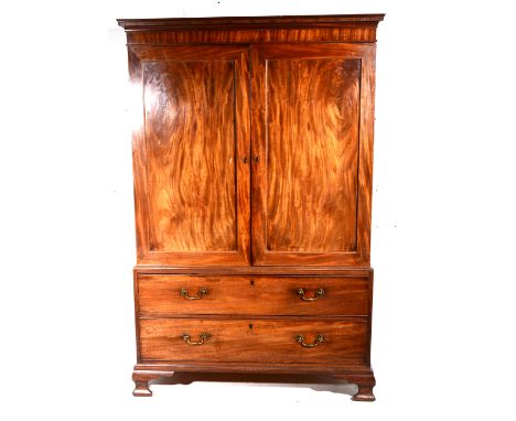 George III mahogany linen press, cavetto moulded cornice, plain frieze, panelled doors enclosing two slides above two drawers