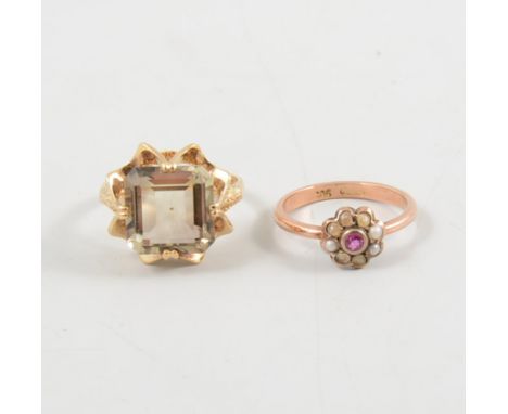 A smoky quartz dress ring, the square cut stone claw set in a 9 carat yellow gold mount ring size Q and a rose metal ring mar