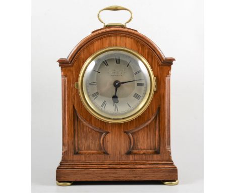 Oak bracket clock, domed case the dial signed Russells Limited, Manchester, single fusee movement, 37cm.
