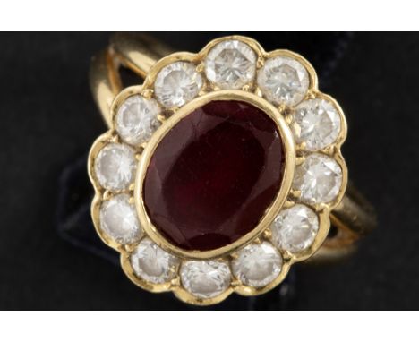 ring in yellow gold (18 carat) with an oval ca 3 carat ruby, surrounded by ca 1,20 carat of high quality brilliant cut diamon
