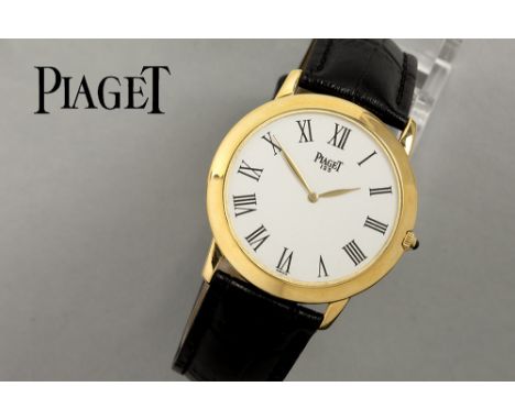 extra flat vintage "Piaget" marked mechanic wristwatch (ref 9920) dating around 1990 in yellow gold (18 carat) - with leather