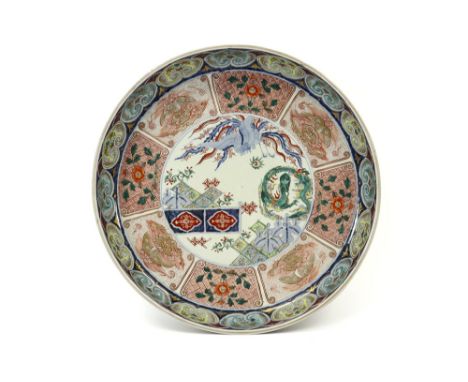 quite large 18th Cent. Japanese basin in porcelain with a rich Imari decor with phoenix and dragonVrij groot achttiende eeuws
