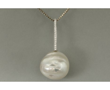 pendant in white gold (18 carat) with a quite big baroque shaped South Sea pearl and ca 0,20 carat of quality brilliant cut d