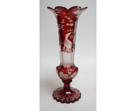 A Bohemian wheel engraved ruby glass vase (a.f.). 35cm tall