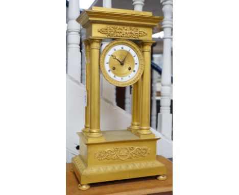 A large mid 19th century French ormolu portico clock. 49cm tall