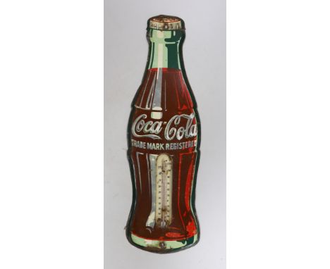 An enamelled Coca-Cola sign in the shape of a bottle, with a thermometer, 43cms high