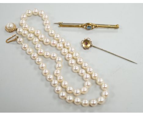 A single strand cultured pearl necklace, with 9ct gold clasp, 46cm, together with a yellow metal and ruby stick pin and a sim