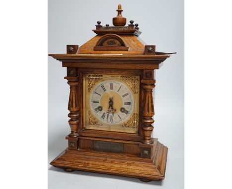 A German oak cased clock, plaque reads ‘Presented to Harry Collins on the occasion of his marriage by the members of Bradford