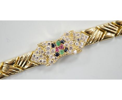 A modern 585 yellow metal, ruby, sapphire, emerald and diamond cluster set bracelet, 17.5cm, gross weight 18.9 grams.