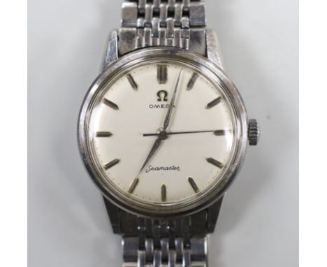 A gentleman's stainless steel Omega Seamaster manual wind wrist watch, on steel Omega bracelet, case diameter 35mm.