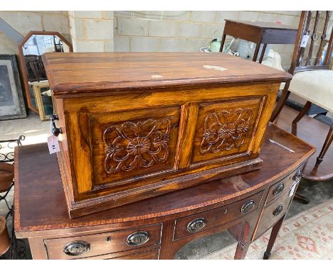 A modern carved hardwood trunk, length 80cm, depth 40cm, height 43cm
