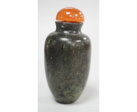 A Chinese green and black jade snuff bottle, 19th century, 5.3 cm Provenance - the former owner collected jades and snuff bot