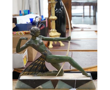 A French Art Deco spelter bronzed model of Diana The Huntress, with ornate marble base, after Uriano. 49cm wide