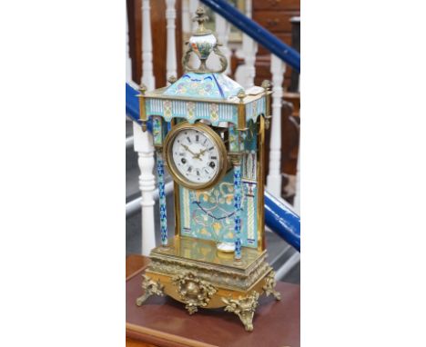 A large blue enamelled mantel clock with pendulum. 66cm tall