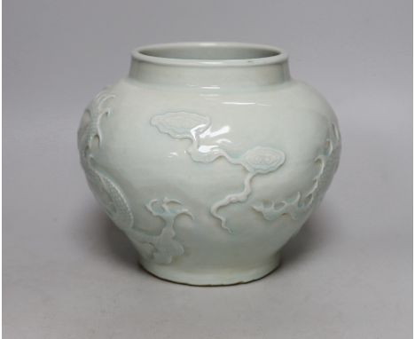 A Chinese relief moulded ‘dragon’ vase, 17cms