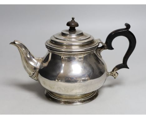 A George V silver baluster teapot, Goldsmiths &amp; Silversmiths Co Ltd, London, 1924, gross weight 18.9oz.