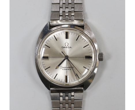 A gentleman's 1970's? stainless steel Omega Seamaster Cosmic manual wind wrist watch, on associated bracelet, case diameter 3