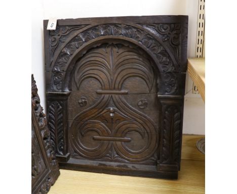 A 17th century style carved oak panel, 57cms wide x 64cms high