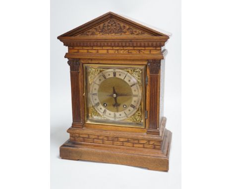 A late 19th century German oak mantel clock, 40.5cm