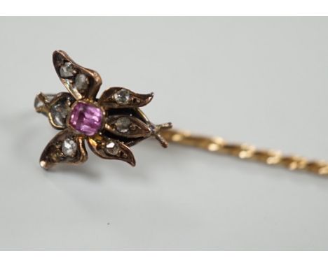 A Victorian yellow metal, pink stone and rose cut diamond set bug stick pin, 72mm, gross weight 1.6 grams.