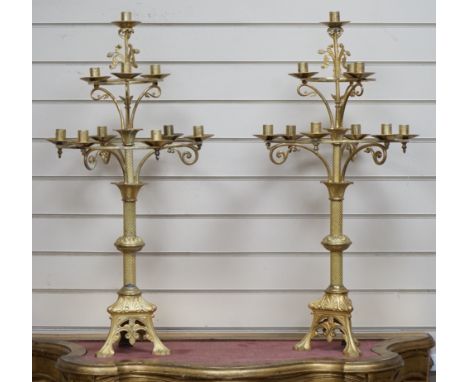 A pair of French neo-gothic ormolu two tier ten light candelabra. 83cm tall