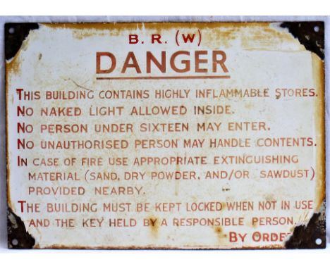 BR(W) Enamel sign. DANGER. THIS BUILDING CONTAINS HIGHLY INFLAMMABLE STORES. Measures 14 x 10 in.
