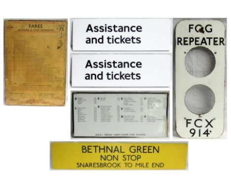 A lot containing London Transport Items to include . BETHANAL GREEN Sign. 1948 Wooden Bus Fare Chart. 2 x Enamel Assistance a