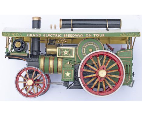 A painted model of a Showman's Traction Engine. Slight damage to top of glass case.