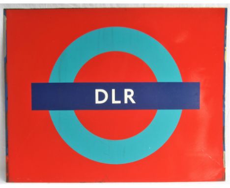 DOCKLANDS LIGHT RAILWAY Roundel on a panel in ex service condition.