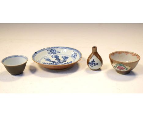 Four items of Chinese café au lait ware, to include tea bowl reserved with Famille Rose panels, and three examples with under