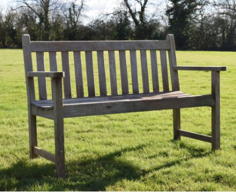 Modern teak garden bench, 126cm wide Condition: Some wear and losses to the bottom of the feet, some splitting along the back