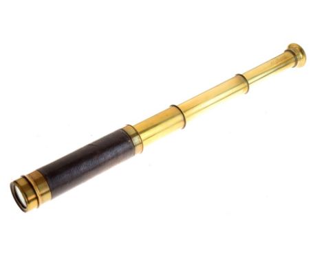 Small three-draw brass and leather bound telescope, marked J. Peacock 68 Strand, London Condition: Light scratches present to