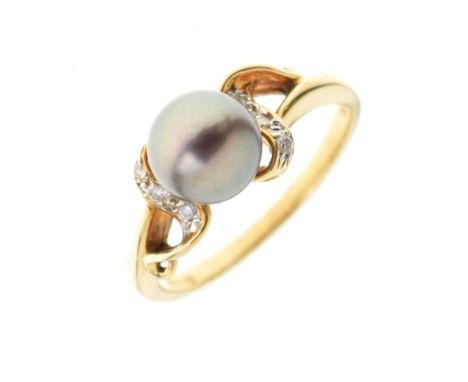 Yellow metal dress ring set tinted pearl between small diamonds, shank stamped 18k/750, size L½, 3.1g gross approx Condition: