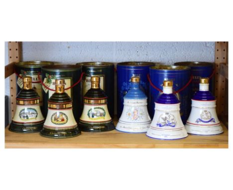 Collection of six Bell's Aged 8 Years Extra Special Old Scotch Whisky ceramic bell shaped decanters commemorating various Chr