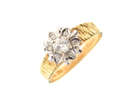 18ct gold diamond cluster ring with textured shoulders, size N, 3.6g gross approx Condition: General condition consistent wit