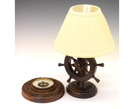 Early 20th Century aneroid barometer, together with a carved wooden novelty table lamp, 24cm x 21.5cm Condition: Losses to mo