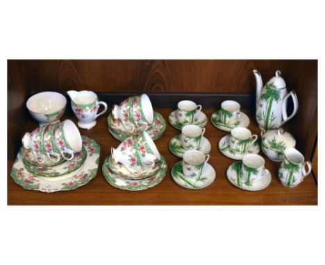 Gladstone 'Rosewood' tea set, together with a Japanese Orion coffee set Condition: Some light wear to the Gladstone set, some
