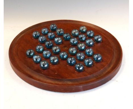 Second half 20th Century mahogany solitaire board with marbles, 34cm diameter Condition: Light wear allover to the finish of 
