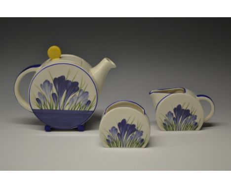 A Wedgwood Bizarre Bonjour Blue Crocus teapot, milk jug and sugar bowl, based on a design by Clarice Cliff, teapot 14cm high,