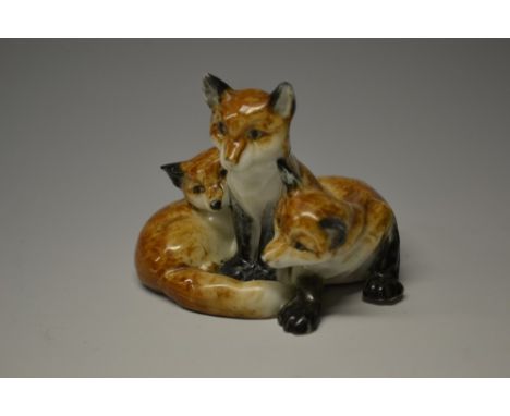 A Royal Worcester animal model,  of three fox cubs,  printed crown and circle mark in puce, model no. 3131
