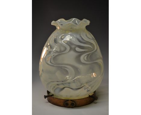 A Victorian Arts and Crafts Vaseline glass ovoid light shade, in swirls of opaque white and uranium yellow, crimped wavy edge